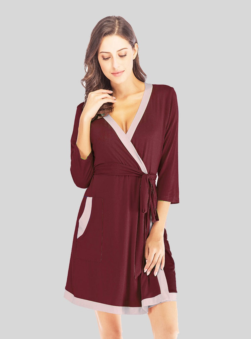 Luxurious Tie Waist Robe with elegant surplice neck and handy pockets. Perfect for style and comfort at home or on the go.