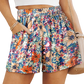 Stylish Floral High Waisted Shorts with pockets perfect for summer. Light fabric, vibrant colors, and versatile design for any occasion.