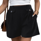 Chic black shorts with decorative buttons and pockets, perfect for versatile summer style and comfort.