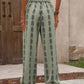 Breathable green pants with adjustable drawstring and unique pattern