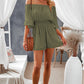 Chic off-shoulder romper with smocked waist and playful flounce sleeves, perfect for a stylish, effortless summer look.