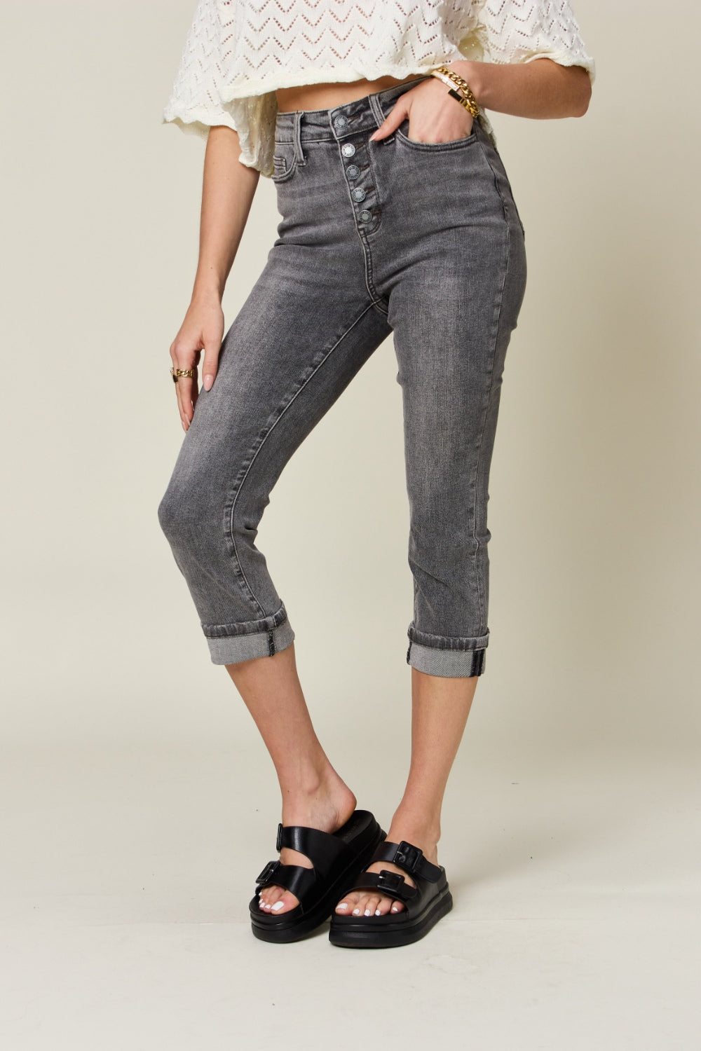 Elevate your wardrobe with Judy Blue's High Waist Cuffed Capris featuring a chic button fly and stretch comfort for all-day wear.