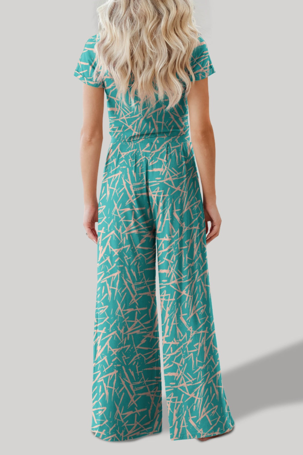 Chic teal printed top and pants set. Versatile, comfortable, and perfect for any occasion. Stand out with effortless style