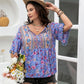 Elegant purple floral blouse with detailed embroidery and relaxed fit
