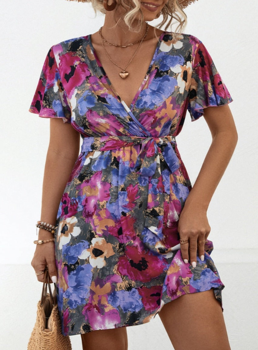 Shop the Printed Surplice Tie Waist Mini Dress – perfect blend of elegance, comfort, and vibrant style for any spring occasion.