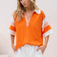 Relaxed fit orange top with stylish white and orange stripes