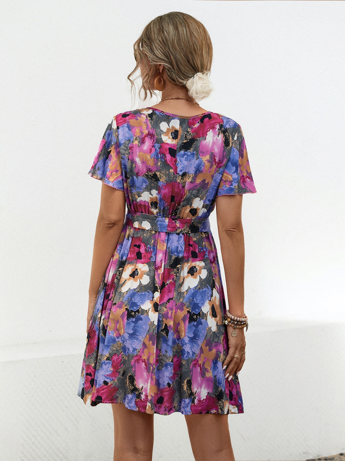 Shop the Printed Surplice Tie Waist Mini Dress – perfect blend of elegance, comfort, and vibrant style for any spring occasion.