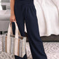 Wide-leg pants designed for comfort and style, available in a range of colors.