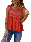Red sleeveless top with embroidered details and tie straps.
