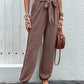 Comfortable brown pants with adjustable waist tie.