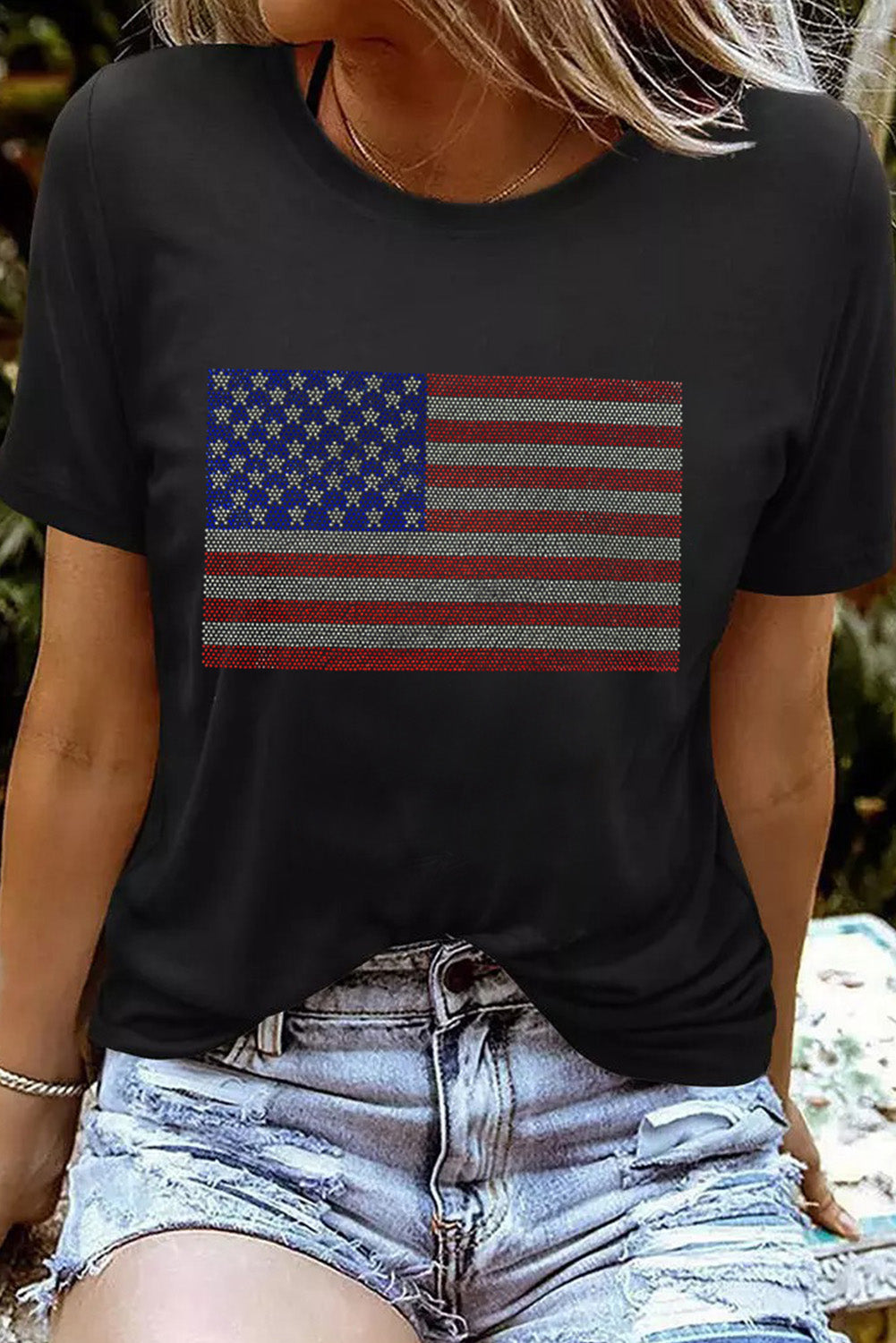 Sparkle in this Black Rhinestone American Flag Tee! Perfect blend of patriotism and style for any casual or celebratory occasion.