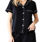 Cozy yet chic lounge set with pockets, perfect for relaxed days at home or quick outings. Ultimate comfort meets style in black with white piping.