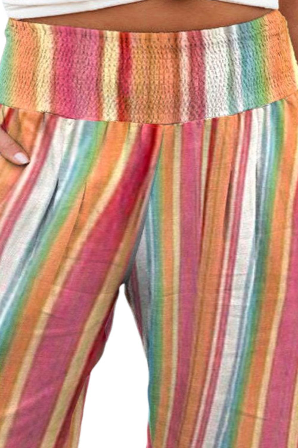 Vibrant rainbow stripe pants in plus sizes, perfect for casual wear.