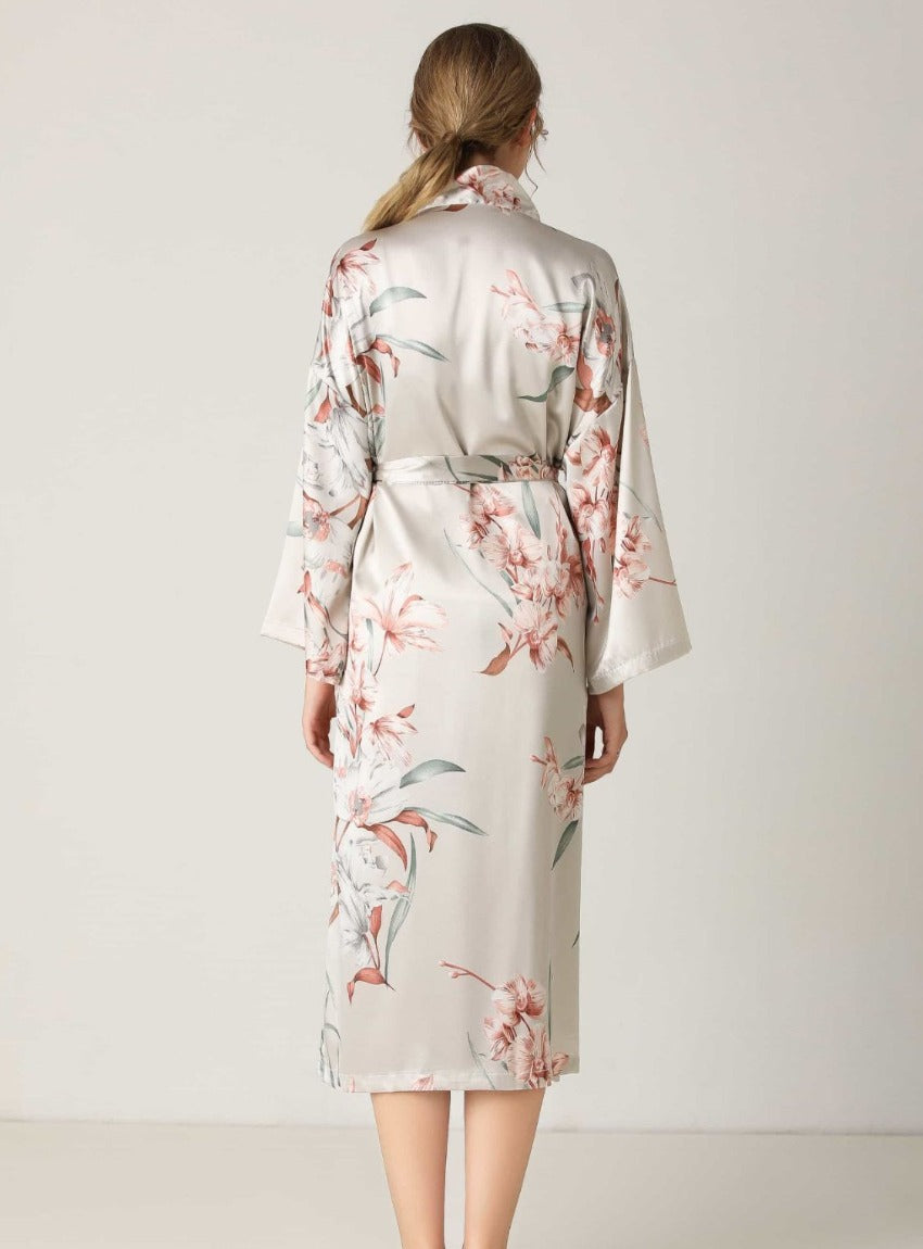 Embrace timeless elegance with our Floral Tie Waist Long Sleeve Robe. Luxurious comfort meets sophisticated style for moments of relaxation and poise.