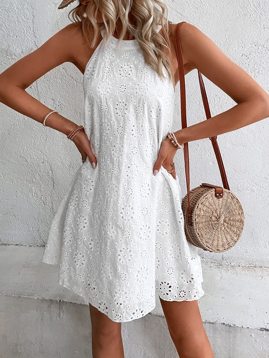 Elevate your wardrobe with the Eyelet Grecian Neck Mini Dress - perfect for any occasion with a timeless design and comfortable fit.