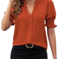 Orange notched short sleeve blouse with stylish ruffle details