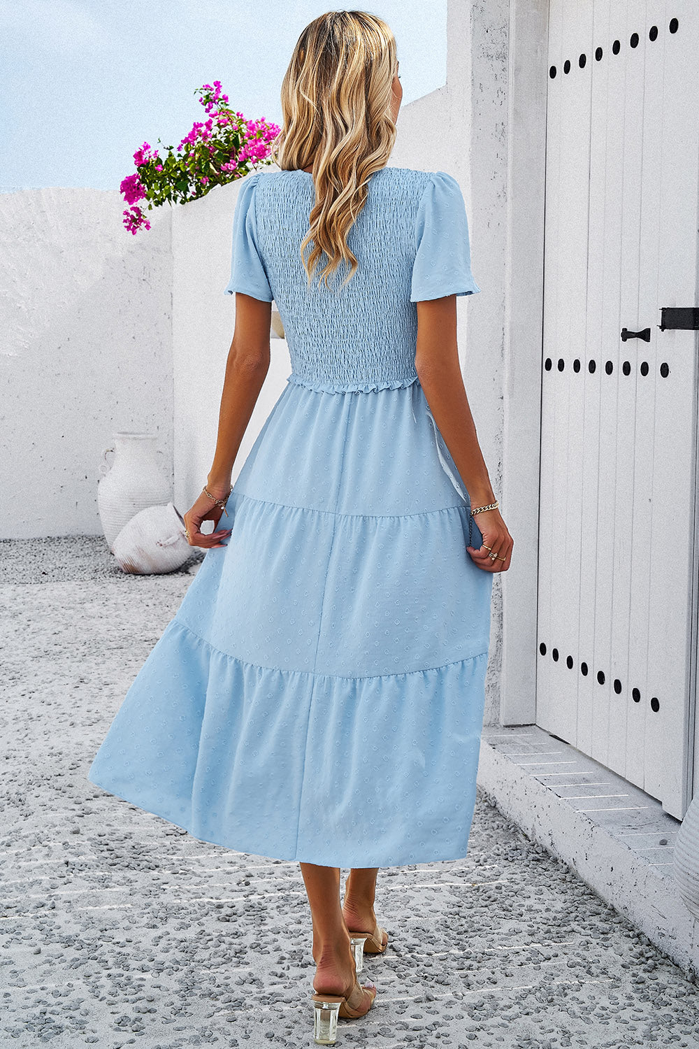 Swiss Dot Dress with a flattering smocked design, available in black, cream, moss, and blue. Perfect for any summer occasion