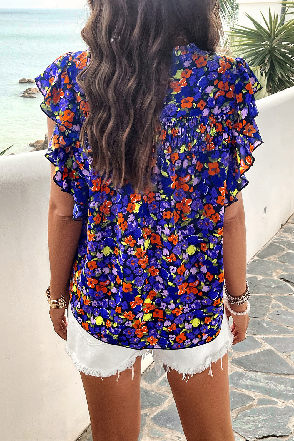 Embrace spring with this floral Smocked Mock Neck Blouse. Perfect for any occasion, available in 5 colors for a fresh, stylish look