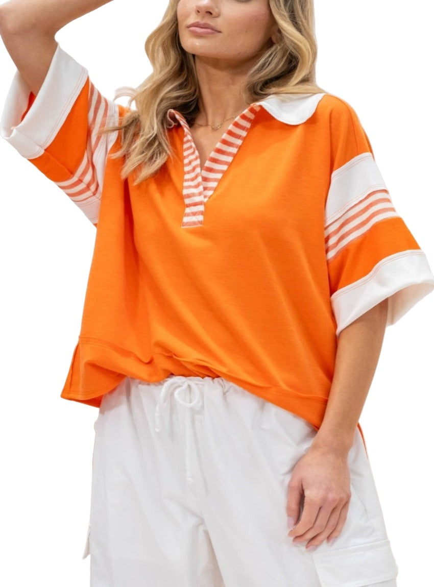 Bright orange pullover with white and orange stripe details