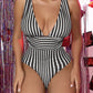 Discover your beach-ready look with our chic striped one-piece swimsuit. Featuring a flattering V-neck and stylish design, it's perfect for any summer outing.
