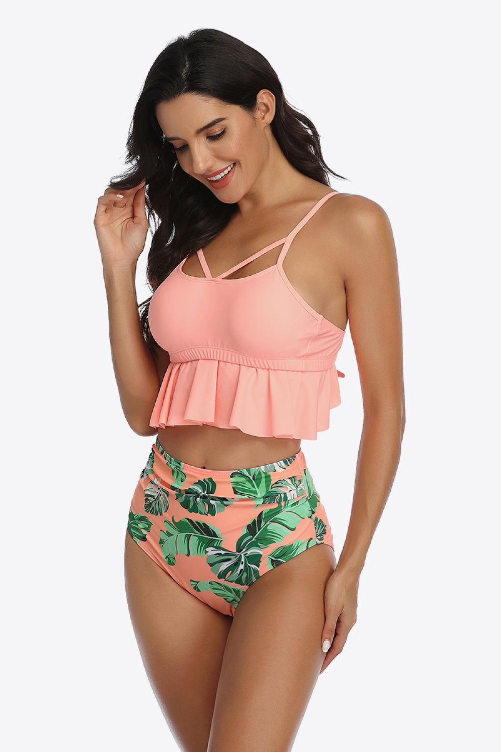 Dive into style with our Tropical Print Ruffled Two-Piece Swimsuit. Perfect fit, vibrant colors, and ultimate comfort for your sunny getaways.