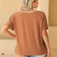 Chic brown colorblock T-shirt with stylish cold shoulder detail, perfect for casual or upscale looks. Comfort meets elegance