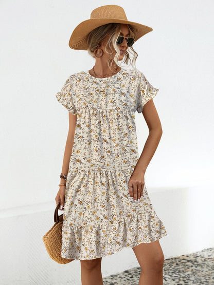 Summer's charm in a dress! Discover our Floral Tiered Dress, perfect for day/night elegance. Available in black and sand.
