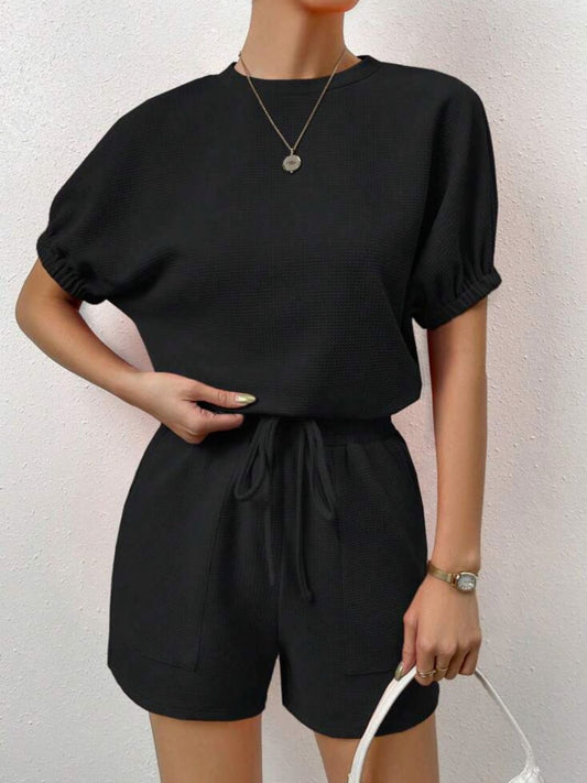 Chic black lounge set with short-sleeve top and elastic waistband shorts