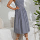 Lightweight blue gingham dress with a fitted smocked bodice