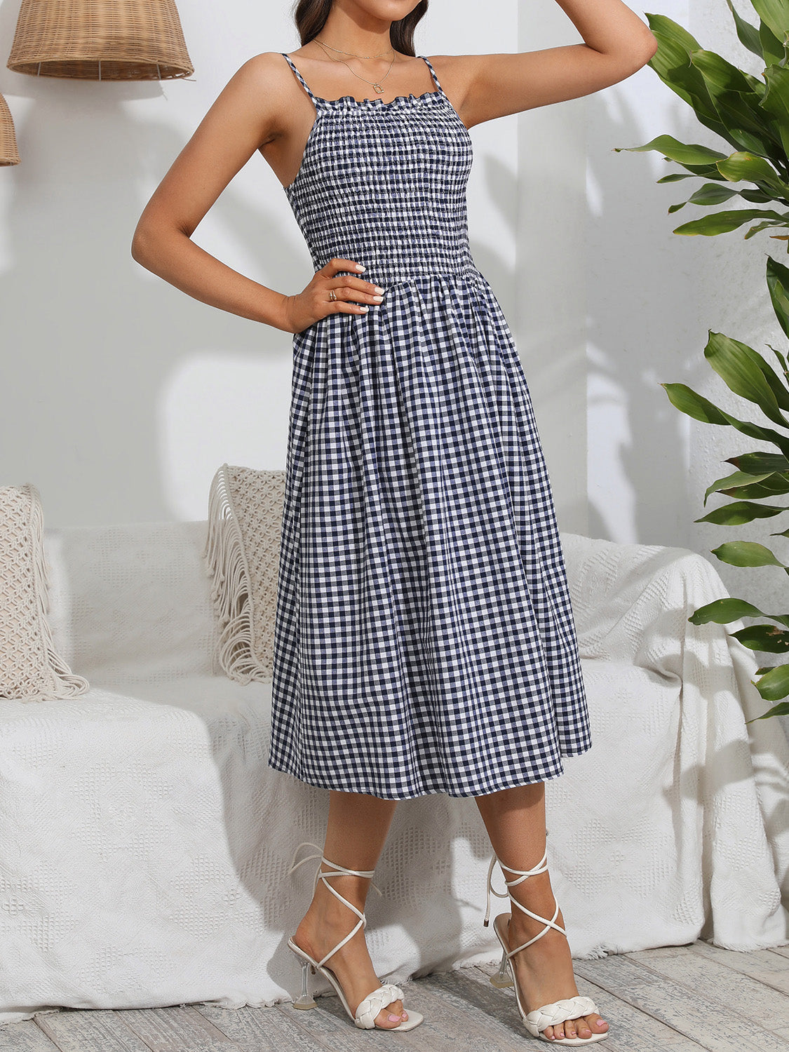 Lightweight blue gingham dress with a fitted smocked bodice
