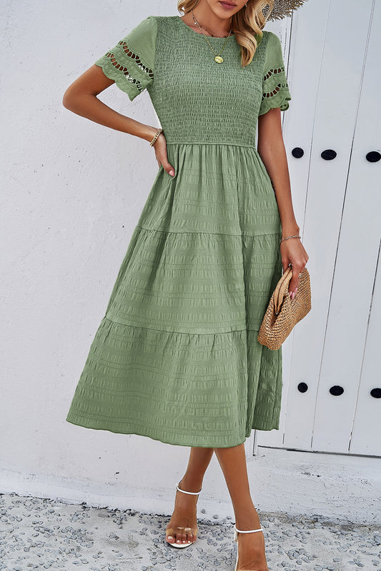 Discover elegance with our Smocked Midi Dress, perfect for any occasion. Comfort meets style in five beautiful colors.