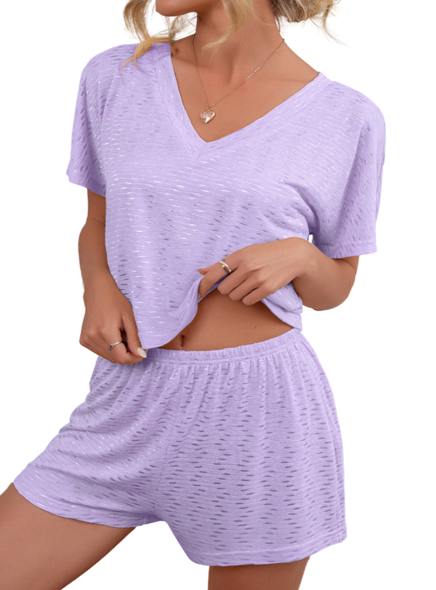 Cozy yet chic V-neck top and shorts set in lavender. Perfect for lounging or casual outings with breathable fabric for all-day comfort.