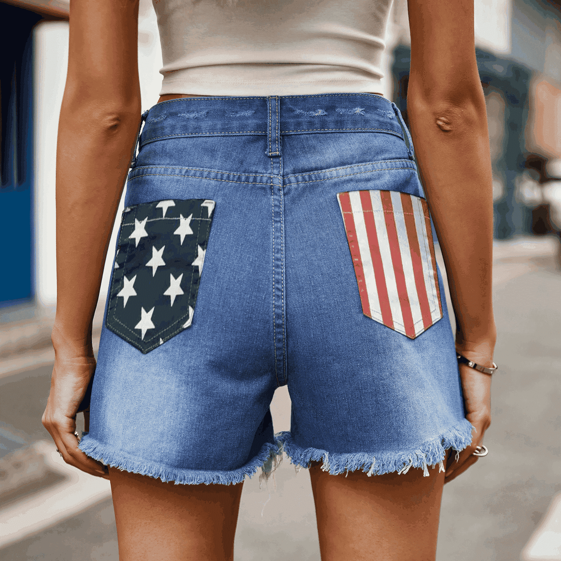 Step into the bold US Flag Distressed Denim Shorts, a perfect blend of patriotic flair and trendy style for any casual occasion.
