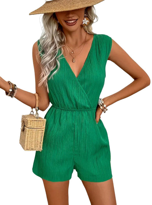 Green sleeveless romper featuring an elastic waist.