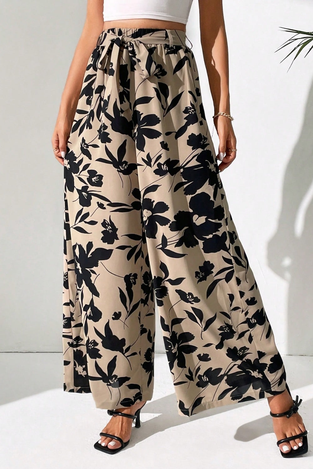 Upgrade your style effortlessly with our Printed Tied Wide Leg Pants. Chic, comfortable, and versatile - perfect for any occasion. Shop now!