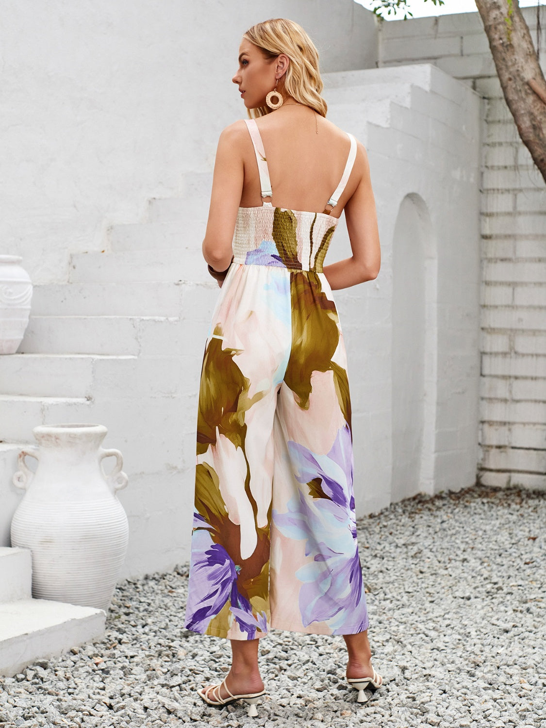 Embrace summer with our Cutout Jumpsuit featuring a vivid print, breezy fabric, and a flattering silhouette for effortless style.