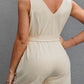 Chic sleeveless romper with a belted waist & button front. Perfect for any occasion, offering style and comfort