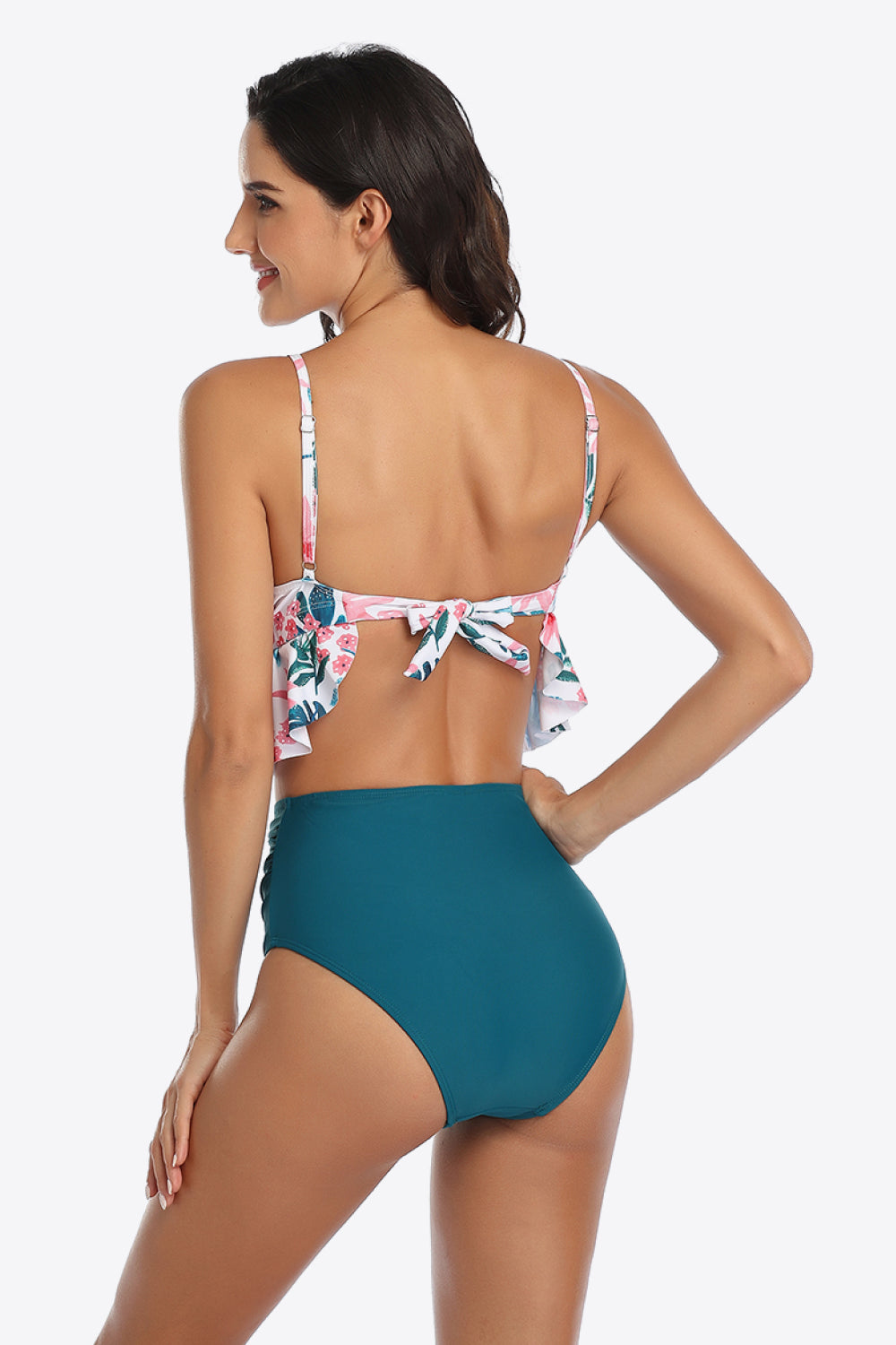 Dive into style with our Tropical Print Ruffled Two-Piece Swimsuit. Perfect fit, vibrant colors, and ultimate comfort for your sunny getaways.