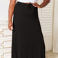 Black maxi skirt with a flattering, flowing design.