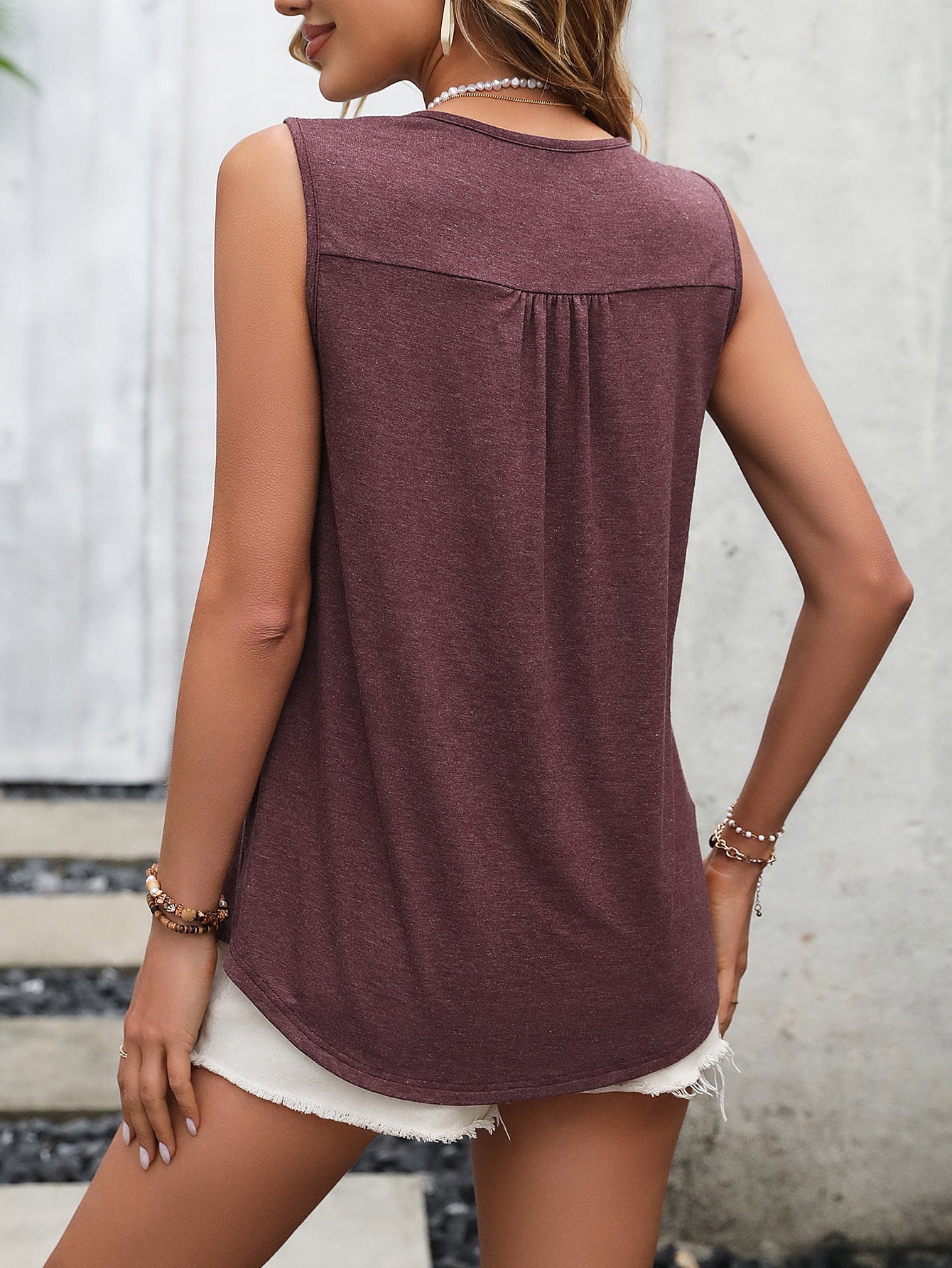 Women's wine-colored tank top with lace detail and button front.