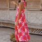 Side view of a floral print maxi dress with tie straps and a flowing design.