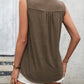 Brown lace-trimmed sleeveless top with button front.