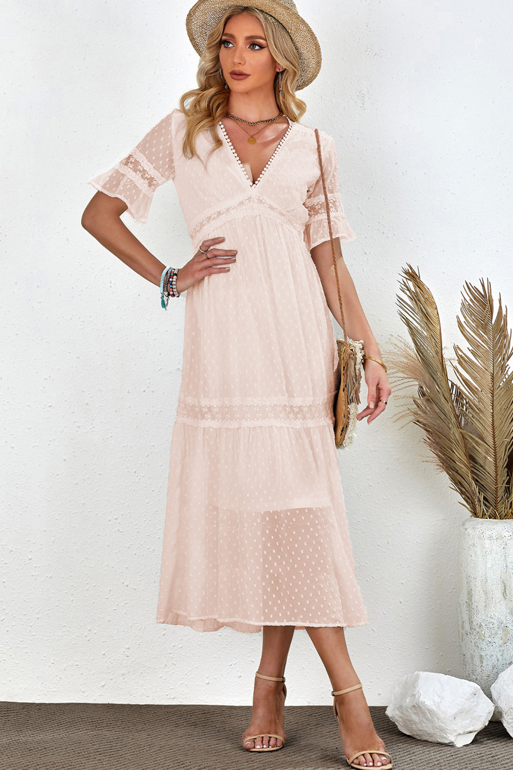 Chic Swiss Dot Midi Dress in white/peach, with a flattering V-neck and airy sleeves, perfect for summer days and elegant evenings.