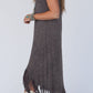 Boho-chic sleeveless midi dress with playful tassels, perfect for versatile day-to-night style. Comfort and elegance in one.