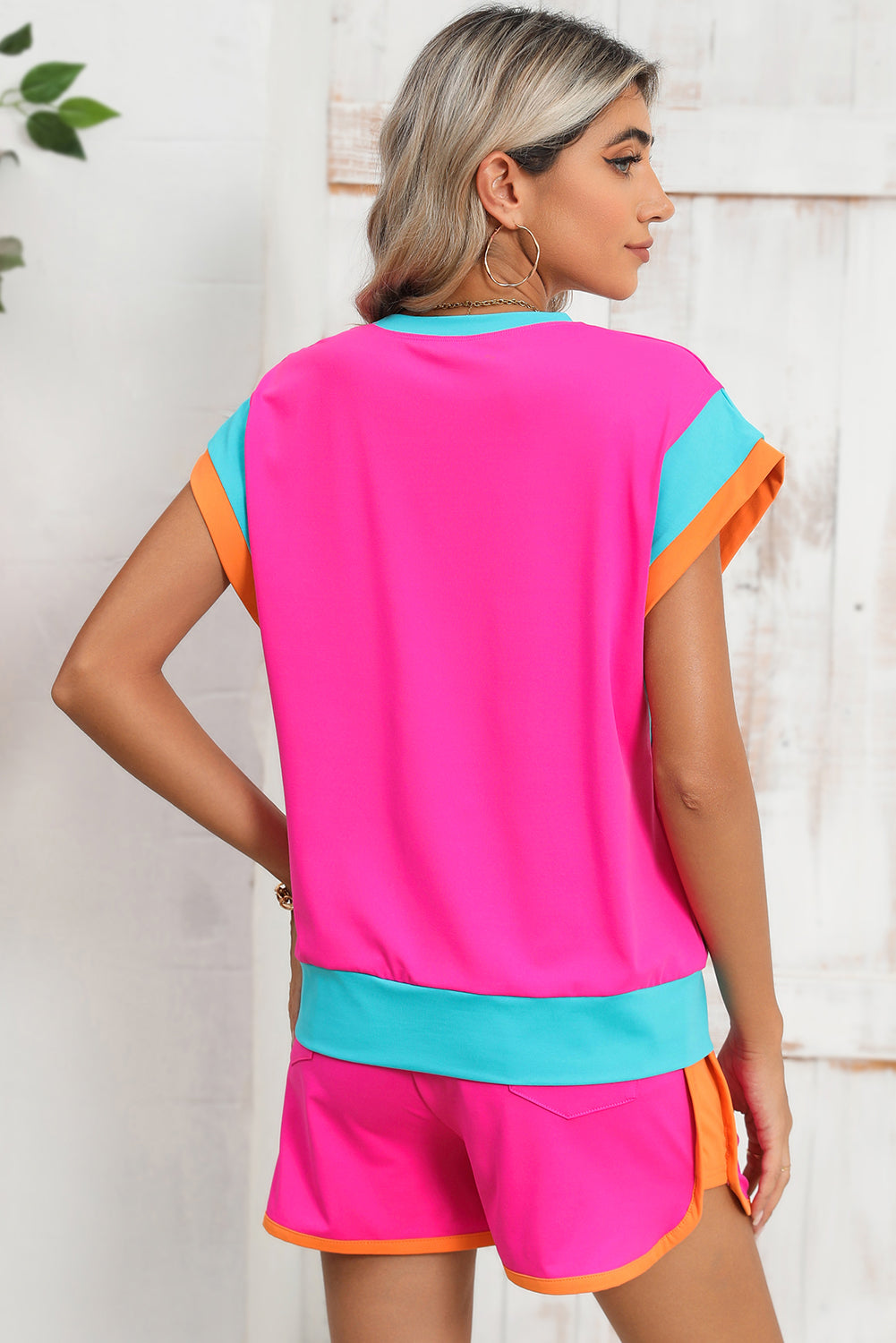 Pink and teal sporty short-sleeve top and shorts