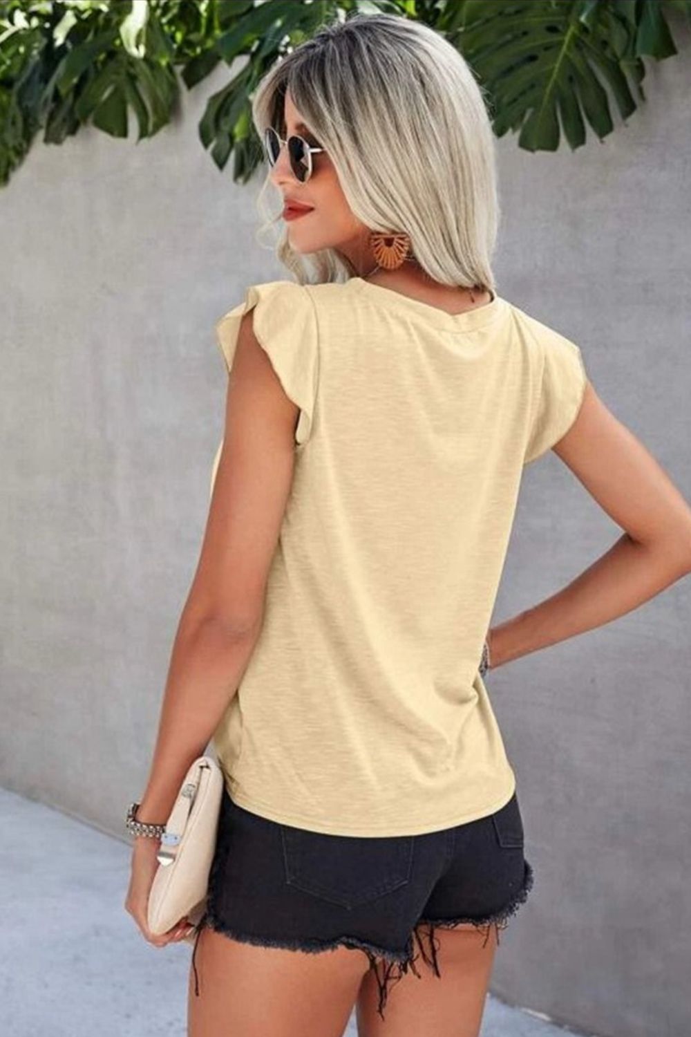 Chic Ruffled Cap Sleeve T-Shirt with breathable fabric and elegant eyelet details. Perfect for casual or dress-up occasions.