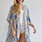 Geometric pattern kimono with tassels, available in blue and yellow