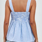 Blue gingham smocked bodice and peplum top