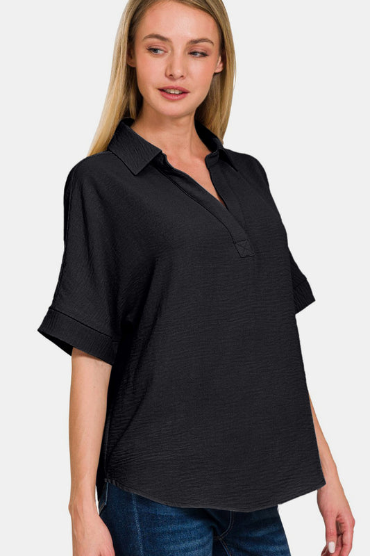 Simple and chic black blouse with a collar and easy-care features