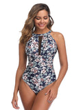 Chic floral one-piece swimsuit with an elegant open back design, perfect for a stylish summer by the pool or on the beach